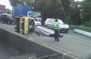 Truk Muat Pipa Terguling di Tol