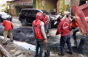 Pengaspalan Jl Abdul Karim Rungkut